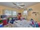 Bedroom with neutral walls, a large window overlooking a lake, and standard furnishings and decor at 253 Blackwell Villa Cv, Babson Park, FL 33827