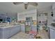 Spacious kitchen with stainless appliances, ample counter space and a ceiling fan at 253 Blackwell Villa Cv, Babson Park, FL 33827
