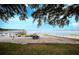 View of the waterfront, featuring a boat trailer, dock, and serene water views at 253 Blackwell Villa Cv, Babson Park, FL 33827