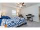 Bright bedroom with a large window and comfortable seating area at 2566 Red Egret Dr, Bartow, FL 33830