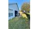 View of the backyard featuring a patio and a lush green lawn at 295 Lake Suzanne Dr, Lake Wales, FL 33859