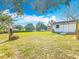 Spacious backyard with mature trees and detached shed, great for outdoor activities at 309 S 5Th St, Lake Wales, FL 33853