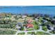 Aerial view of the home on a large lot with a pool overlooking a lake at 3312 Eagles Trce, Winter Haven, FL 33884
