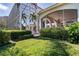 Screened outdoor space with covered lanai, lush landscaping, and access to the main house at 3312 Eagles Trce, Winter Haven, FL 33884