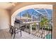 Open-air balcony with wrought iron railing overlooking the pool area and offering views of the landscaped backyard at 3312 Eagles Trce, Winter Haven, FL 33884