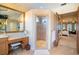 Bright bathroom with shower, vanity, and doorway to the bedroom at 3312 Eagles Trce, Winter Haven, FL 33884
