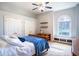 A comfortable bedroom with neutral walls, two closets, and a traditional wooden bed frame at 3312 Eagles Trce, Winter Haven, FL 33884