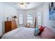 Light filled bedroom featuring arched windows, decor, and ample space at 3312 Eagles Trce, Winter Haven, FL 33884