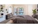Modern bedroom with a view of the pool through sliding glass doors, complemented by sleek furniture at 3312 Eagles Trce, Winter Haven, FL 33884