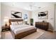 Serene bedroom featuring a rustic wooden bed frame, neutral tones, and modern decor at 3312 Eagles Trce, Winter Haven, FL 33884