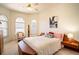 Light filled bedroom featuring arched windows, decor, and ample space at 3312 Eagles Trce, Winter Haven, FL 33884