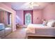 Bright bedroom featuring a cozy window seat, and mirrored closet doors at 3312 Eagles Trce, Winter Haven, FL 33884