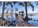 Private dock with covered seating, providing a tranquil space to enjoy water views at 3312 Eagles Trce, Winter Haven, FL 33884