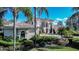 Attractive side view of home featuring architectural details, manicured landscaping and a beautiful brick driveway at 3312 Eagles Trce, Winter Haven, FL 33884