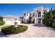 Elegant home with a circular driveway, fountain, and a three-car garage at 3312 Eagles Trce, Winter Haven, FL 33884