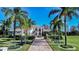 Stunning home featuring lush landscaping, a beautiful brick driveway, and striking architectural details at 3312 Eagles Trce, Winter Haven, FL 33884