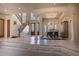 Grand foyer with staircase, columns, high ceilings, and adjacent formal dining room at 3312 Eagles Trce, Winter Haven, FL 33884