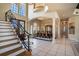 Spacious foyer with staircase, columns, high ceilings, and dining area at 3312 Eagles Trce, Winter Haven, FL 33884