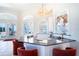 Kitchen bar with seating overlooking an outdoor view at 3312 Eagles Trce, Winter Haven, FL 33884
