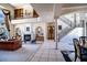 Open-concept living room with staircase, fireplace, built-ins, and grand decor at 3312 Eagles Trce, Winter Haven, FL 33884