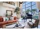 Bright living area with large windows, a grand piano, and comfortable seating at 3312 Eagles Trce, Winter Haven, FL 33884