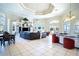 Spacious living room featuring tile floors, large seating area, and water views at 3312 Eagles Trce, Winter Haven, FL 33884