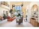 Elegant living room featuring a fireplace, large windows, and stylish decor at 3312 Eagles Trce, Winter Haven, FL 33884