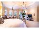 Spacious main bedroom featuring chandelier, ensuite bath, and bay windows at 3312 Eagles Trce, Winter Haven, FL 33884
