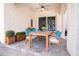 Covered patio with dining table, plants, and lots of space, perfect for alfresco dining at 3312 Eagles Trce, Winter Haven, FL 33884