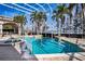 Stunning screened pool with palm trees and ample space for lounging and entertainment at 3312 Eagles Trce, Winter Haven, FL 33884