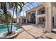 A backyard pool and spa in a screened lanai offer a private resort-like experience at 3312 Eagles Trce, Winter Haven, FL 33884