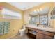 Full bathroom with a window, large mirror, and a toilet at 3418 Raleigh Dr, Winter Haven, FL 33884