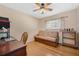 Bedroom with wooden floors and a futon at 3418 Raleigh Dr, Winter Haven, FL 33884