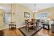 Dining area with hardwood floors, a chandelier, and a view of the sliding glass doors at 3418 Raleigh Dr, Winter Haven, FL 33884