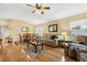Open concept living room and dining area featuring hardwood floors and cozy seating at 3418 Raleigh Dr, Winter Haven, FL 33884