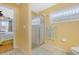 Bathroom shower with a glass door, next to the toilet at 3418 Raleigh Dr, Winter Haven, FL 33884