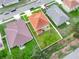 A clear aerial view shows the property line and yard with mature trees at 3526 Warbler Way, Kissimmee, FL 34746