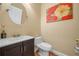 Cozy half-bathroom featuring ceramic tile flooring and decorative wall art at 3526 Warbler Way, Kissimmee, FL 34746