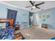 Childs room with carpet, fan, and celestial decor at 3526 Warbler Way, Kissimmee, FL 34746