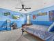Themed bedroom with carpet and ceiling fan at 3526 Warbler Way, Kissimmee, FL 34746
