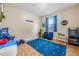 Fun game room complete with arcade games and blue accents at 3526 Warbler Way, Kissimmee, FL 34746