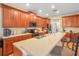 Well-equipped kitchen with granite countertops and stainless steel appliances at 3526 Warbler Way, Kissimmee, FL 34746