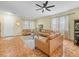 Comfortable living room featuring leather furniture and neutral decor at 3526 Warbler Way, Kissimmee, FL 34746