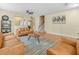 Comfortable living room featuring leather sofas, tile flooring, and an open layout at 3526 Warbler Way, Kissimmee, FL 34746