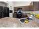 A view of the kitchen with modern appliances and ample counter space at 3750 Park Ave, Indian Lake Estates, FL 33855