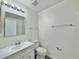 Clean bathroom featuring modern fixtures, a new vanity, and tile flooring at 3807 Mckinley Dr, Winter Haven, FL 33880