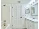 Bathroom featuring a tub, shower, vanity, and toilet at 3807 Mckinley Dr, Winter Haven, FL 33880