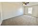 Spacious bedroom with a ceiling fan and a window with blinds at 3807 Mckinley Dr, Winter Haven, FL 33880