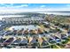 A high-angle view of a residential area with homes near a lake at 3828 Eloise Estates Ct, Winter Haven, FL 33881