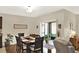 Dining room features wood floors, a modern light fixture, and sliding glass doors to the screened lanai at 3828 Eloise Estates Ct, Winter Haven, FL 33881